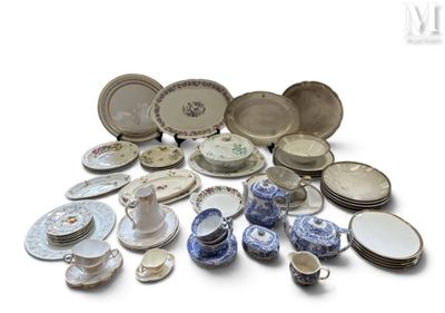 many different types of plates and bowls on the table