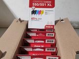 boxes of ink cartridges are stacked on top of each other in a cardboard box