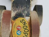 a close up of a skateboard on a white surface
