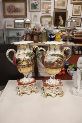 three vases that are sitting on a table in a room