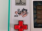 a close up of a game and watch controller