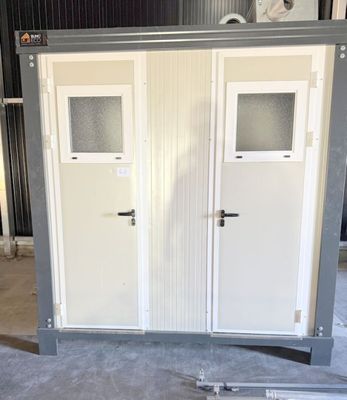 two doors that are open on the side of a building