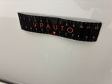 a close up of a measuring tape on a white car