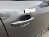 a close up of a car door handle with a sticker on it