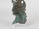 a close up of a sculpture of a head on a stand