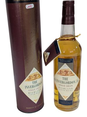 an image of a bottle of whisky next to a cardboard box