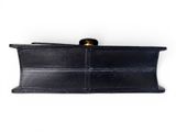 a black leather wallet with a gold clasp on it