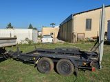 a trailer that is parked in the grass