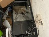 a television sitting on the floor in the corner of a room
