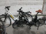two bikes that are parked next to each other