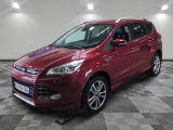 the red ford kuga is parked on a checkered floor