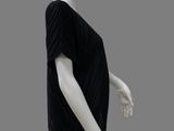 an image of a mannequin wearing a black top and black pants