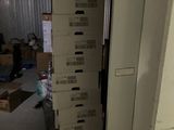 boxes stacked on top of each other in a storage room