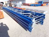 a large metal structure sitting in the middle of a parking lot