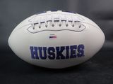 a close up of a football with the word huskies on it