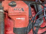 a red tool in a red box on the ground