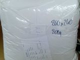 a box with a white pillow on it sitting on a table