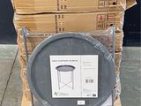 a stack of boxes and a plastic container on a pallet