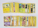 a lot of pokemon cards that are on the table