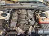 a picture of a car engine with its hood open