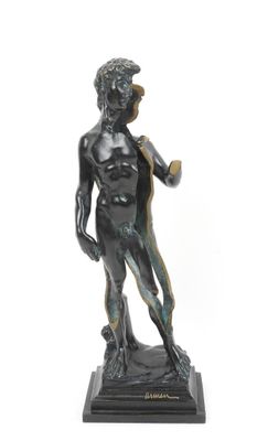 statue of a boy holding a baseball bat on a marble base