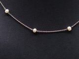 a white pearl necklace on a mannequin mannequin mannequin mannequin mannequin mannequin mannequin mannequin manne