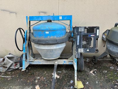 a blue mixer sitting on a cart next to a wall