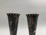two vases that are sitting next to each other on a table