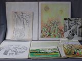 a table with a bunch of drawings and pictures on it