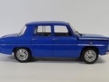 an image of a blue toy car sitting on top of a white surface