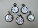quatre montres de poche en argent comportant des chiffres romains