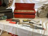 a table with tools and a tool box on it