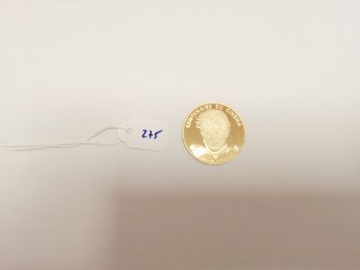 a gold coin with a picture of a man on it