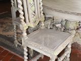a table and chairs in a room with a rug on the floor