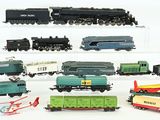 a lot of toy trains on display on a white surface