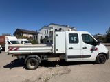the white truck is parked in the parking lot next to a house