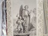 a picture of an angel and a child in a box