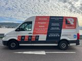 the van is parked on the side of the road in the parking lot