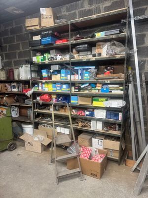 many boxes and boxes on the shelves in the garage