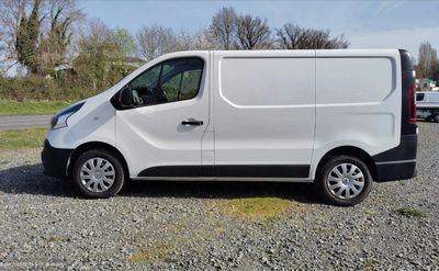 a white van that is parked in a lot