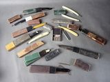a lot of different types of knives on the table