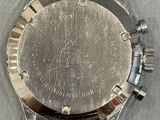 a close up of a watch on a table