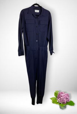 navy blue jumpsuit with buttoned front and long sleeves