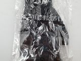 a plastic bag with a pair of black boots in it