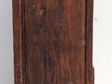an old wooden cabinet sitting on top of a white floor