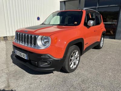 the jeep renegade is parked in front of a building