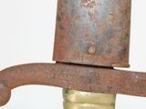 an old rusted hat on top of a bottle of water