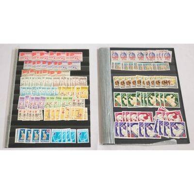 two sets of stamps on display on a table