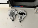 two old light bulbs sitting on a table next to each other