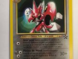 the pokemon card is on display on a white surface
